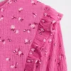 Blusa infantil de punto arrugado con volantes