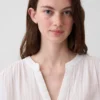 Blusa oversize de gasa de algodón con cuello abierto