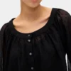 Blusa transparente con botones al frente