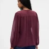Blusa transparente con inserciones de encaje reciclado y cuello con lazo