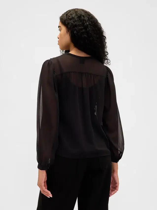Blusa transparente con inserciones de encaje reciclado y cuello con lazo