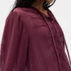 Blusa transparente con inserciones de encaje reciclado y cuello con lazo
