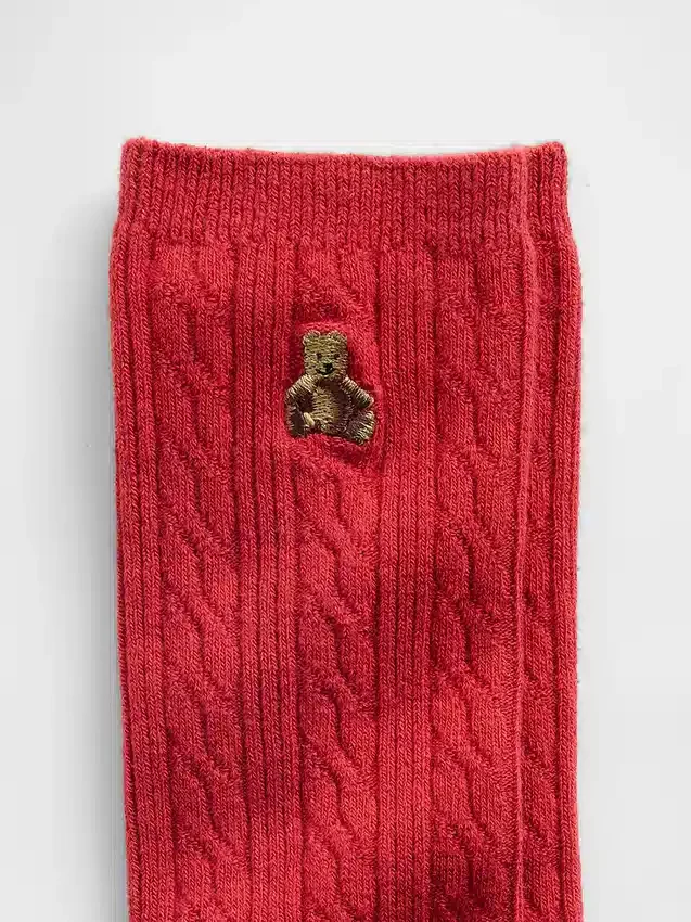 Calcetines de cuello alto con tejido trenzado y el oso Brannan