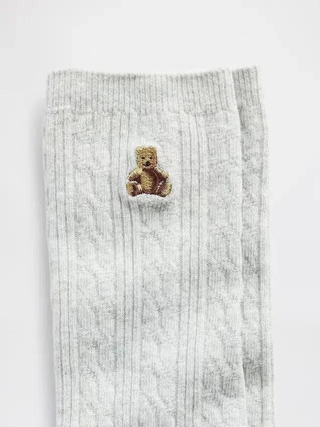 Calcetines de cuello alto con tejido trenzado y el oso Brannan