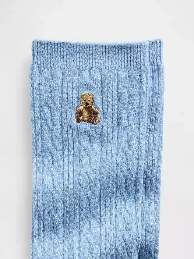 Calcetines de cuello alto con tejido trenzado y el oso Brannan