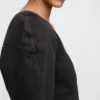 Camisa corta de mezclilla con mangas acampanadas