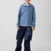 Camisas infantiles de tejido grueso y corte holgado