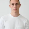 Camiseña con bolsillo de algodón orgánico para adultos