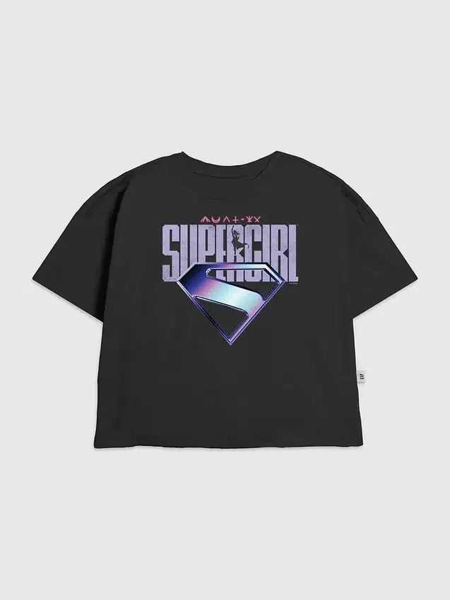 Camiseta infantil con diseño gráfico del logotipo morado de Supergirl