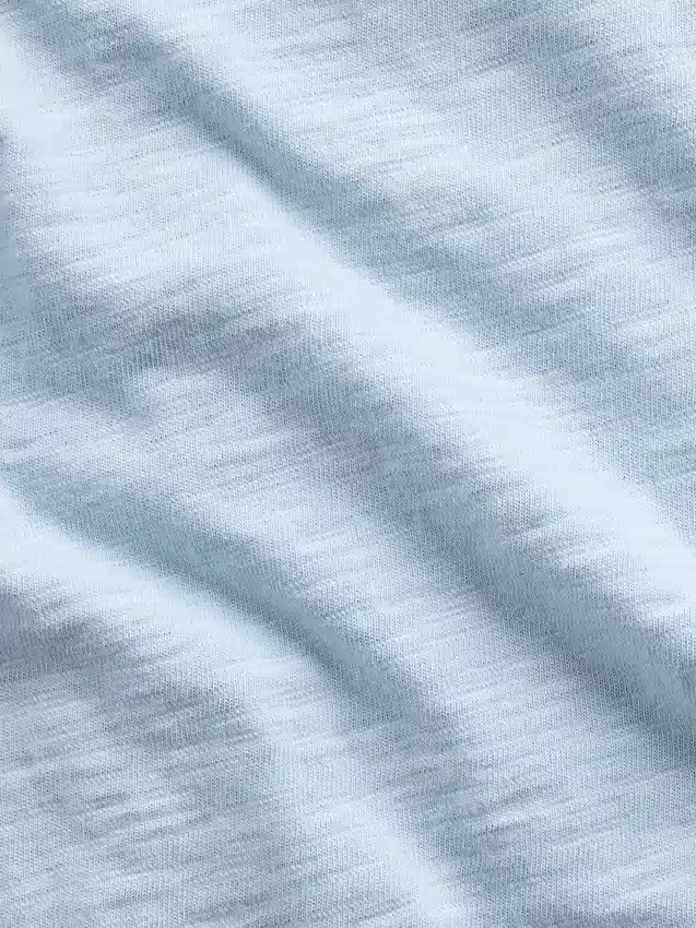 Camiseta infantil de algodón orgánico con bolsillo