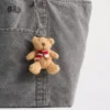 Colgante para bolso con bufanda del oso Brannan