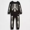 Conjunto de pijama de algodón orgánico cepillado para niños y bebés con esqueleto que brilla en la oscuridad
