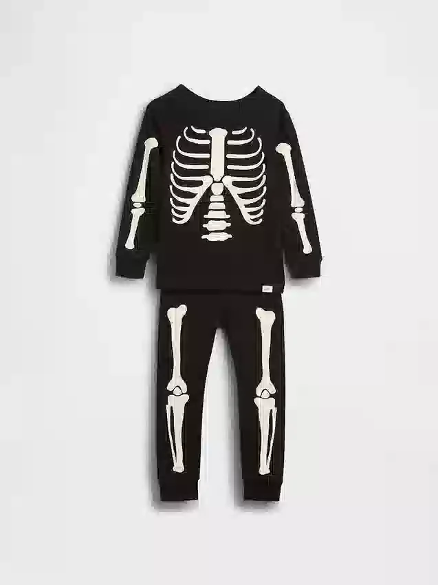 Conjunto de pijama de algodón orgánico cepillado para niños y bebés con esqueleto que brilla en la oscuridad