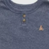 Conjunto de pijama de algodón orgánico jaspeado estilo Henley para bebés y niños