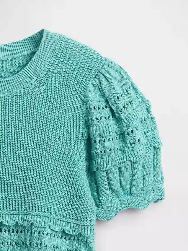 Jerséu infantil con puntadas mixtas y bordes festoneados