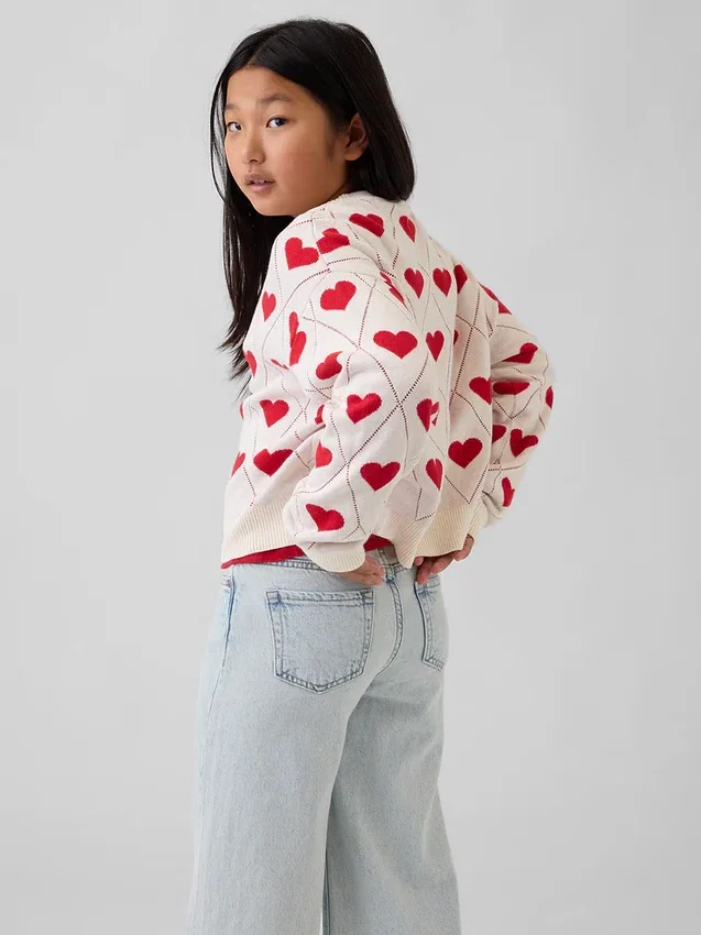 Jerséu infantil de cuello redondo con estampado gráfico y corte holgado