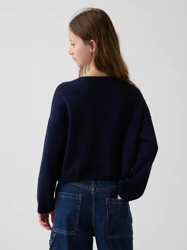 Jerséu infantil de ganchillo oversize con motivos americanos