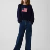 Jerséu infantil de ganchillo oversize con motivos americanos