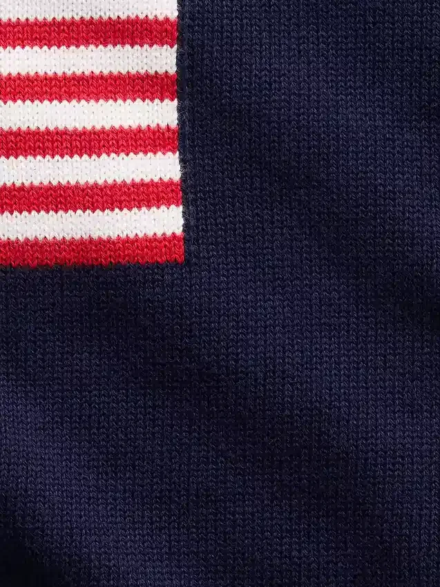 Jerséu infantil de ganchillo oversize con motivos americanos