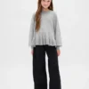 Jerséu infantil holgado con peplum