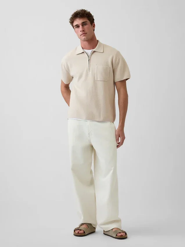 Jerséu polo oversize con bolsillo y cremallera de un cuarto