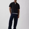 Jerséu polo oversize con bolsillo y cremallera de un cuarto