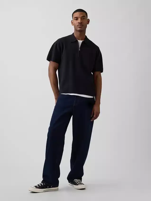 Jerséu polo oversize con bolsillo y cremallera de un cuarto