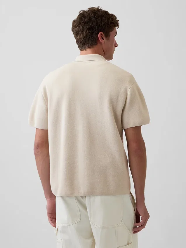 Jerséu polo oversize con bolsillo y cremallera de un cuarto