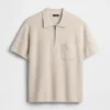 Jerséu polo oversize con bolsillo y cremallera de un cuarto
