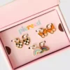 Juego de dijes superventas de Pierced Co