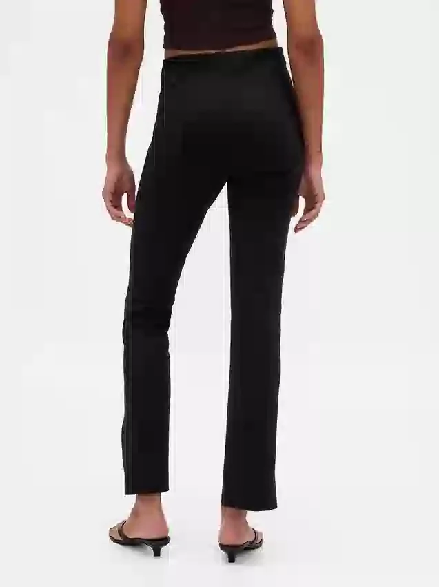 Pantalones acampanados de doble tejido con tiro alto y dobladillo abierto