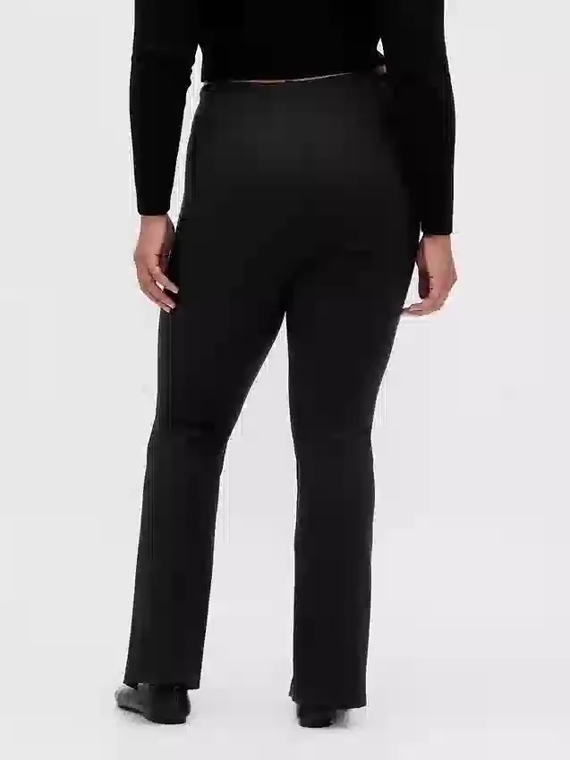 Pantalones acampanados de doble tejido con tiro alto y dobladillo abierto