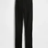 Pantalones acampanados de doble tejido con tiro alto y dobladillo abierto