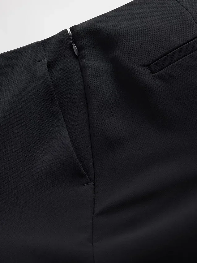 Pantalones acampanados de sarga de talle bajo
