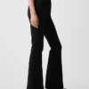Pantalones acampanados de talle alto con tejido elástico en dos direcciones