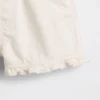 Pantalones cortos de mezclilla con volantes y abertura frontal para bebés y niños pequeños
