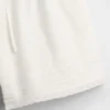 Pantalones cortos fáciles de poner para niños de lino y algodón con ribete de encaje