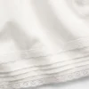 Pantalones cortos fáciles de poner para niños de lino y algodón con ribete de encaje