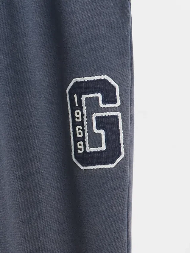 Pantalones de sudadera para adultos de tejido grueso y corte holgado con logo