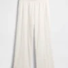 Pantalones de tiro medio con ojales y corte ancho