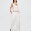 Pantalones de tiro medio con ojales y corte ancho