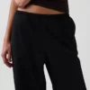 Pantalones holgados de popelín de talle medio y pierna ancha