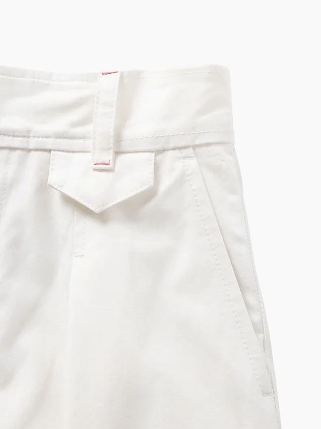 Pantalones plisados de talle alto con corte en arco de GAP × Victoria Beckham