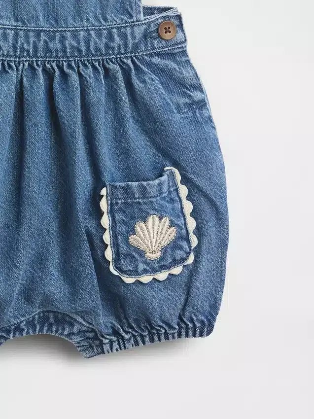 Peto tipo burbuja de mezclilla para bebé con bolsillos de parche