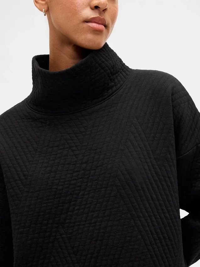 Suéter GapFit de punto jacquard acolchado con cuello de embudo