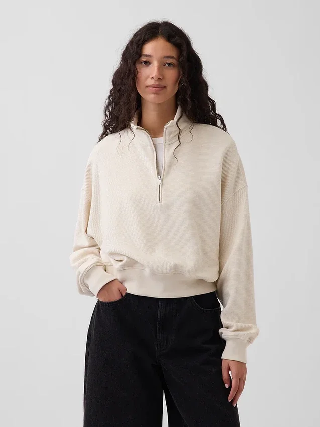 Suéter oversize de algodón texturizado con media cremallera