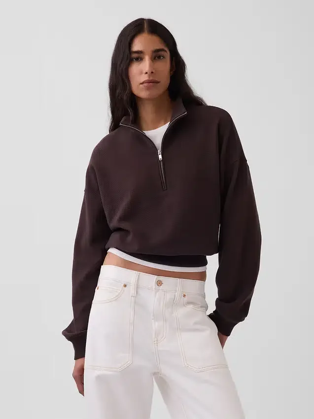 Suéter oversize de algodón texturizado con media cremallera