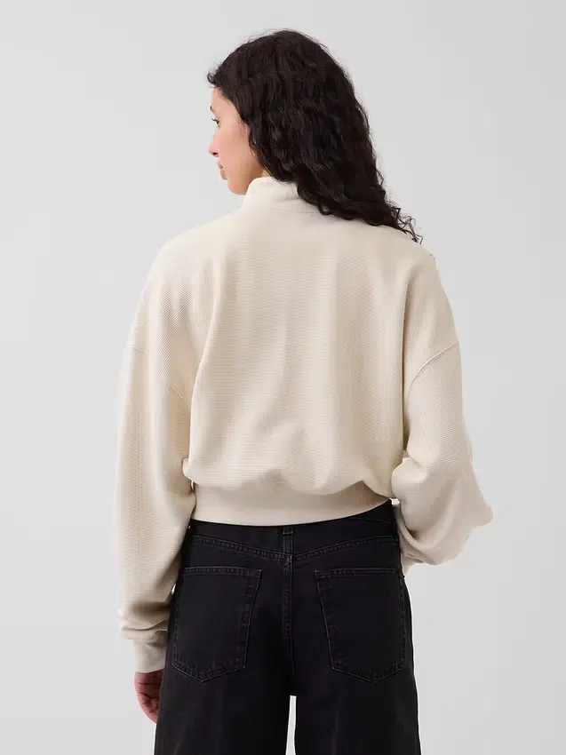 Suéter oversize de algodón texturizado con media cremallera
