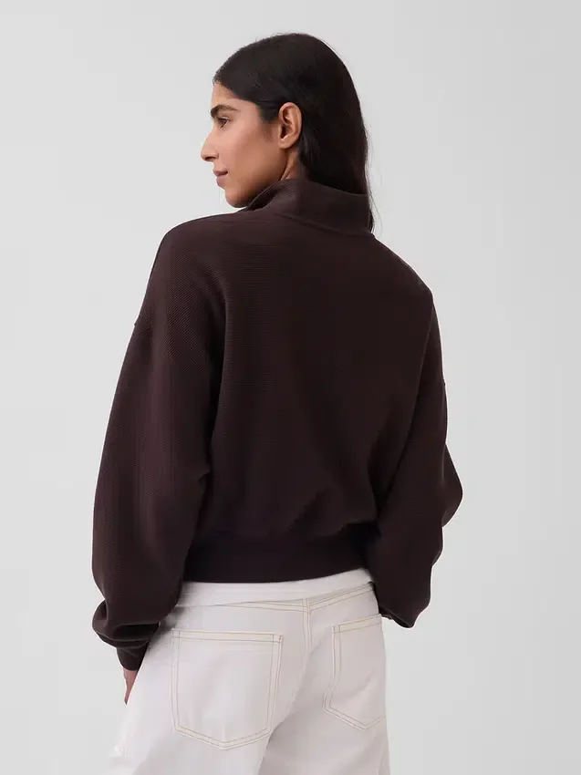 Suéter oversize de algodón texturizado con media cremallera