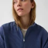 Suéter oversize de algodón texturizado con media cremallera